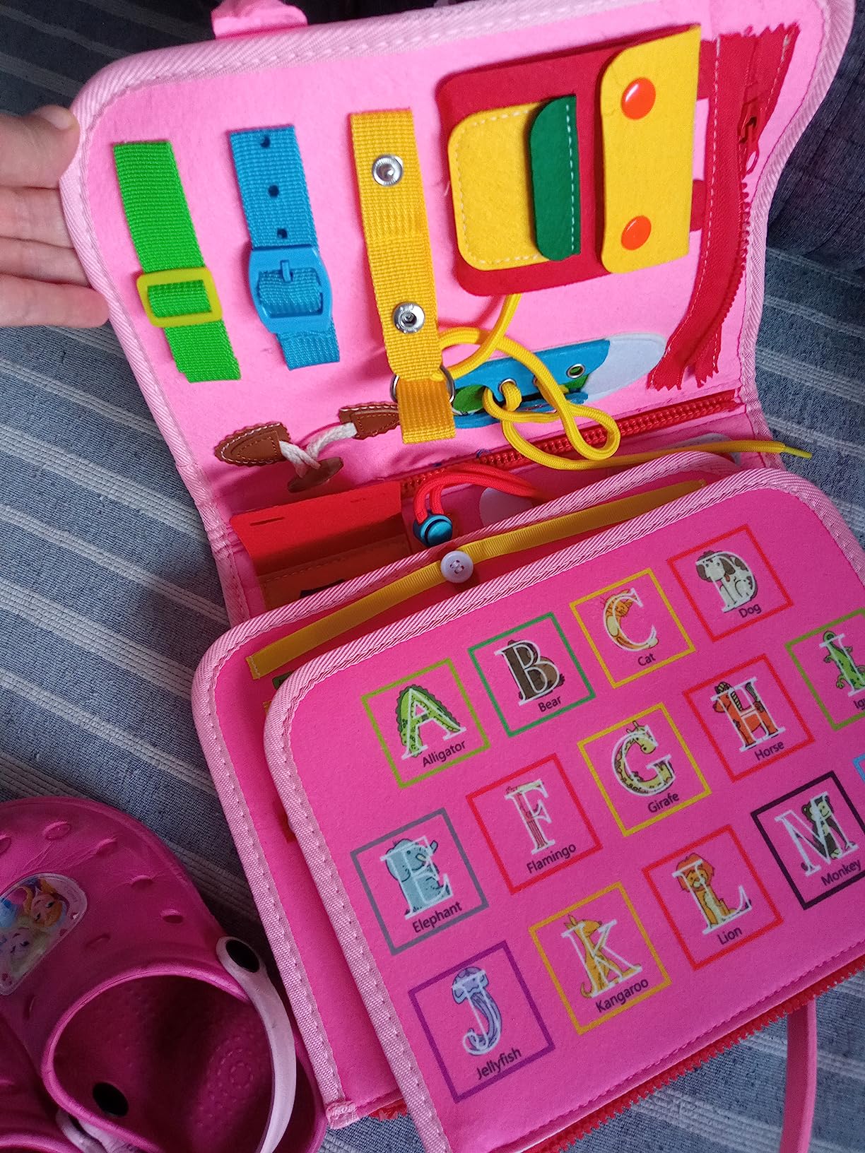 Avis Busy board Montessori rose pour bébé 1 à 4 ans : jouet éducatif avec puzzle